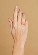 Load image into Gallery viewer, Gold ring with seahorse shaped pink coral on model&#39;s hand
