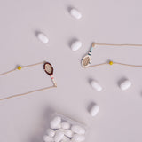 TENNIS PELOTA BURGUNDY NECKLACE