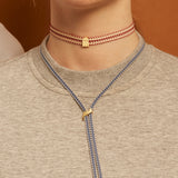DINO COWBOY CORD NECKLACE