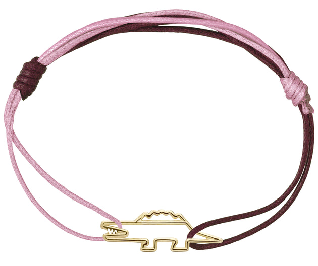 Pink and burgundy cord bracelet with a crocodile shaped gold pendant