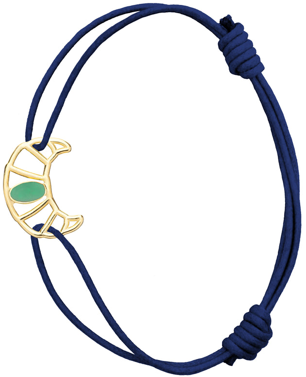 Midnight blue cord bracelet with gold croissant shaped pendant hand-painted in pistachio enamel