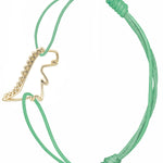 Mint green cord bracelet with gold dinosaur shaped pendant