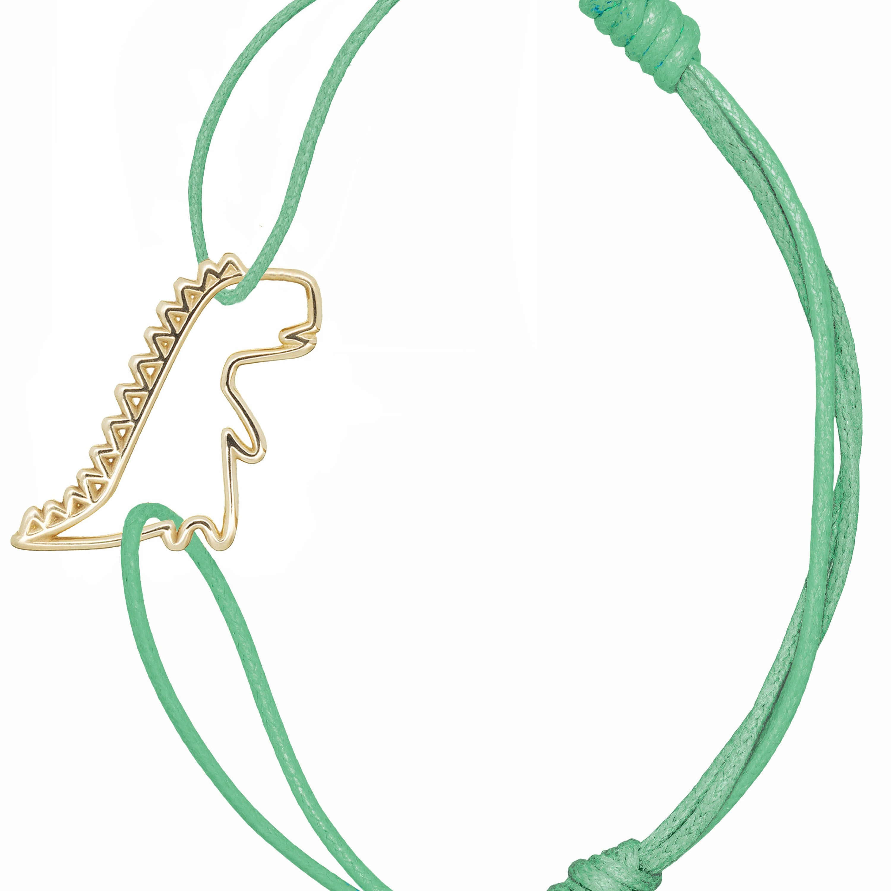 Mint green cord bracelet with gold dinosaur shaped pendant