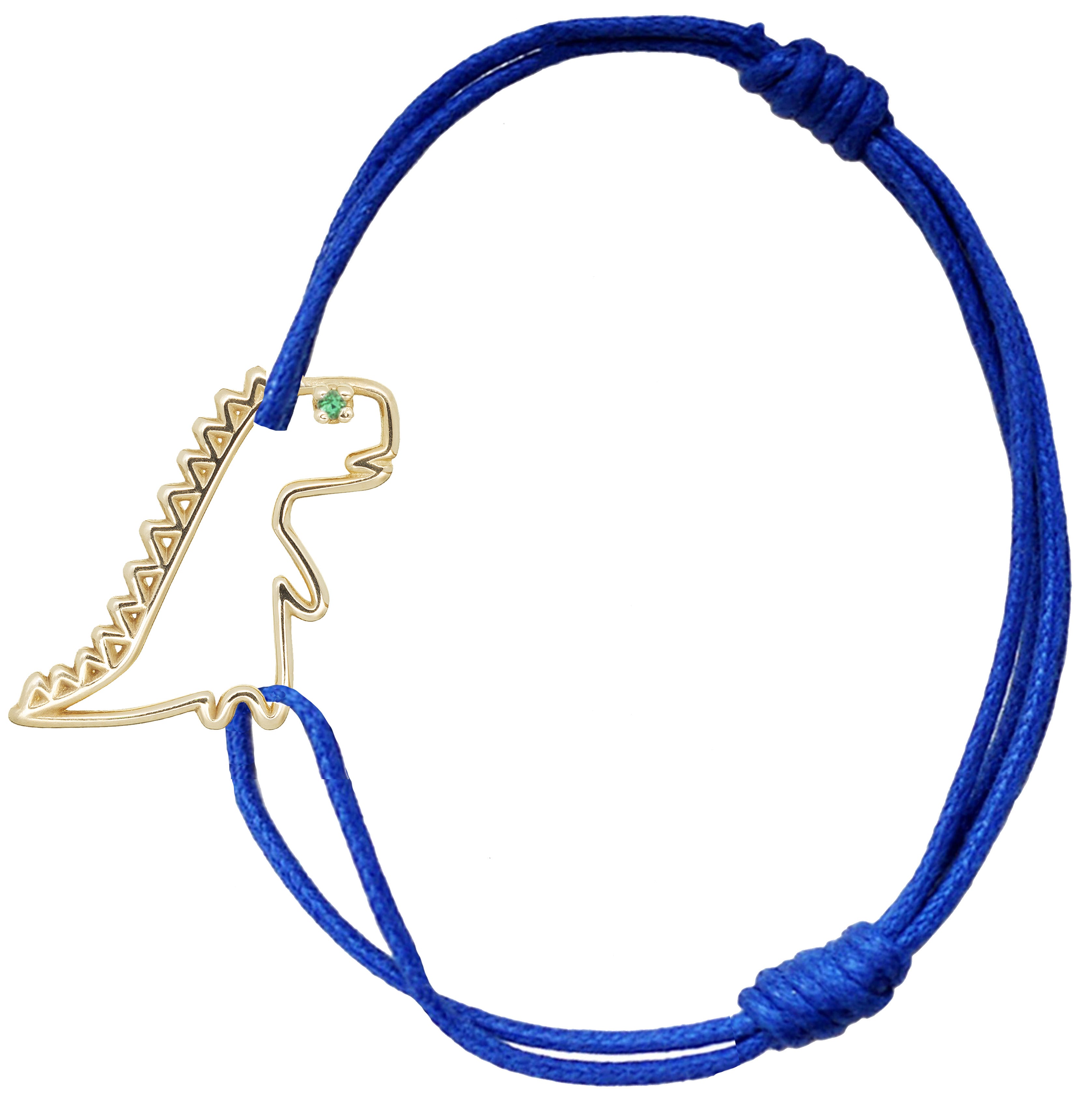 Blue cord bracelet with dinosaur shaped pendant and small emerald
