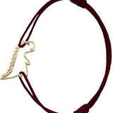 Burgundy cord bracelet with dinosaur shaped pendant and small emerald