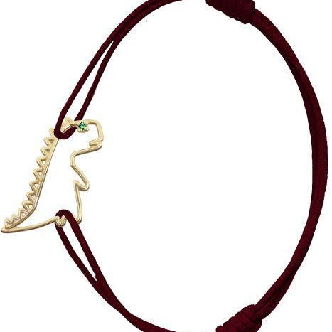Burgundy cord bracelet with dinosaur shaped pendant and small emerald