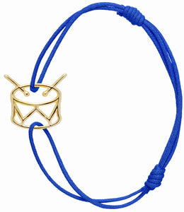 Blue cord bracelet with gold drum shaped pendant