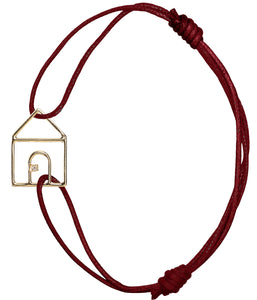 Burgundy cord bracelet with gold house shaped pendant with small diamond