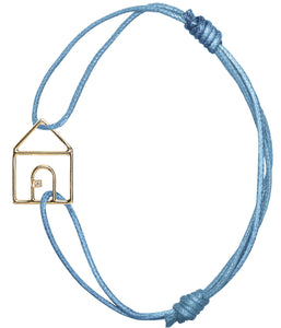 Sky blue cord bracelet with gold house shaped pendant with small diamond