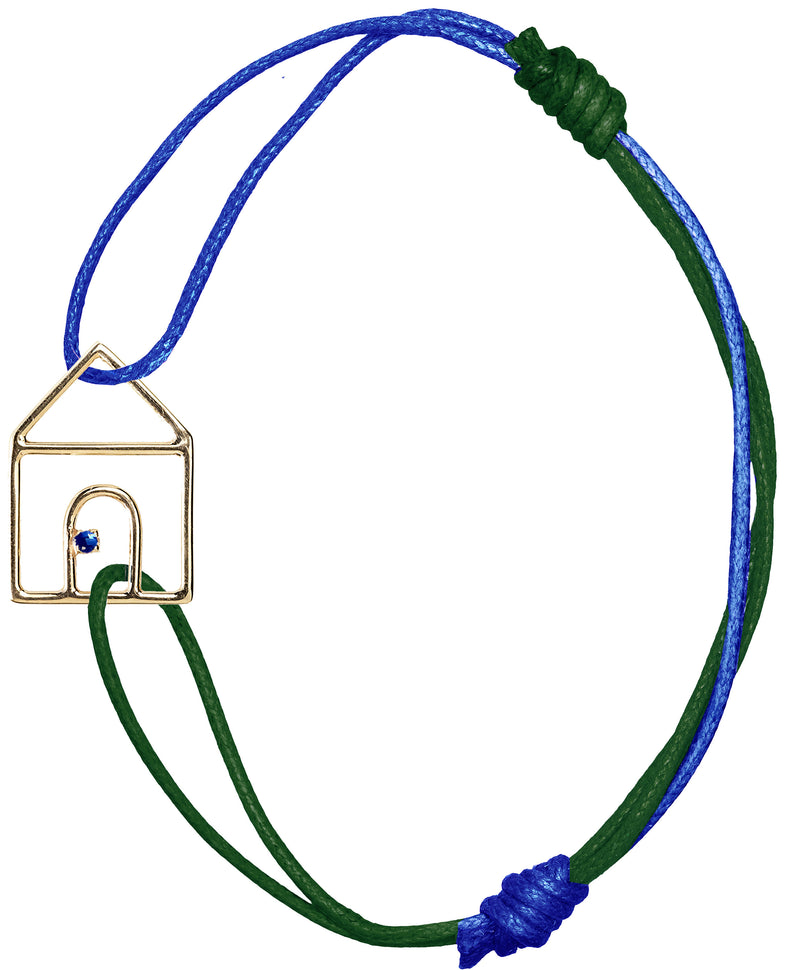 Blue and bottle green cord bracelet with gold house shaped pendant and small blue sapphire