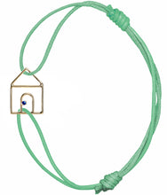 Load image into Gallery viewer, Mint green cord bracelet with gold house shaped pendant and small blue sapphire

