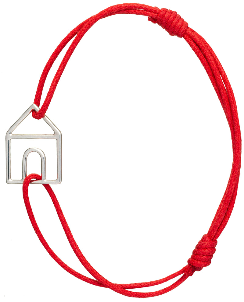 Red cord bracelet with white gold house shaped pendant