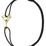 Black eco cord bracelet with a martini drink shaped gold pendant with an small emerald