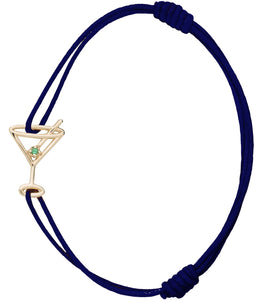Midnight blue cord bracelet with martini drink shaped pendant and small emerald