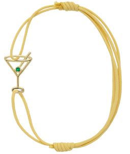 Light yellow eco cord bracelet with a martini drink shaped gold pendant with an small emerald