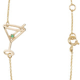 Gold chain bracelet with martini drink shaped pendant  and small emerald