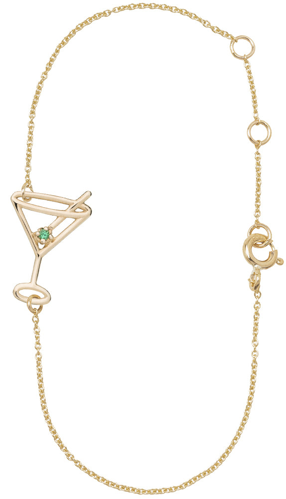 Gold chain bracelet with martini drink shaped pendant  and small emerald