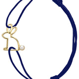 Blue cord bracelet with gold rabbit shaped pendant with pearl