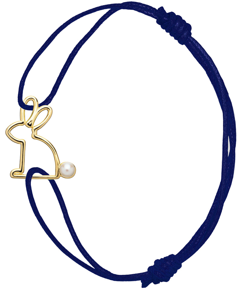 Blue cord bracelet with gold rabbit shaped pendant with pearl