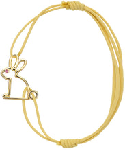 Load image into Gallery viewer, Yellow cord bracelet with a small rabbit shaped gold pendant with a pink sapphire eye

