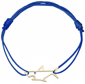 Blue cord bracelet with shark shaped pendant with small blue sapphire eye