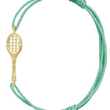 Green cord bracelet with a tennis racquet shaped gold pendant