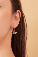 Load image into Gallery viewer, Gold hoop earring with little boat shaped pendant worn by model
