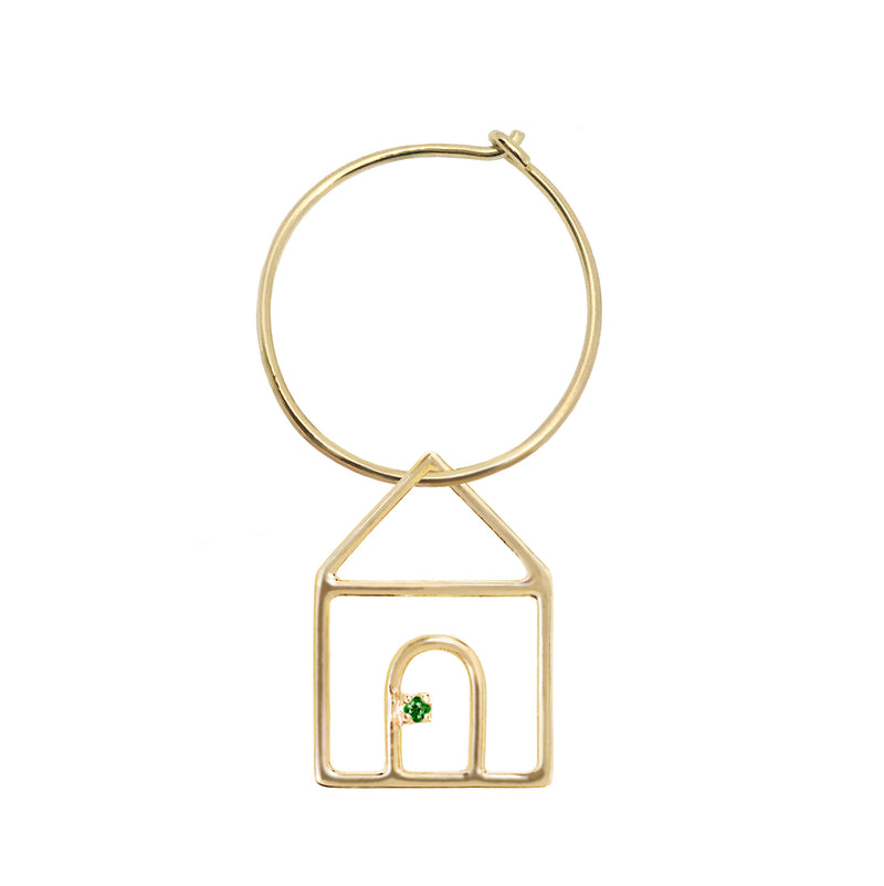 Gold earring circle with house shaped pendant and small emerald