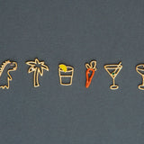 Jewelry gold pendants shaped like dinosaur. palm tree, carrot, tequila shot, martini drink