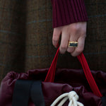 Gold square rings with jasper stone worn by model