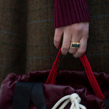 Gold square rings with jasper stone worn by model