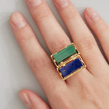 Gold square rings with lapis lazuli and malachite stones worn by model