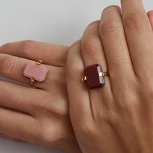 Load image into Gallery viewer, Gold turning ring with carnelian and pink oapl stones on woman&#39;s hands
