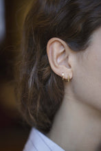 Load image into Gallery viewer, Mini gold hoop earrings worn by model
