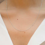 White gold chain necklace with ring clasp worn by model