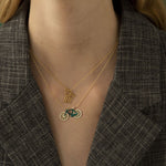 Model wearing gold chain necklaces with family and bike shaped pendants