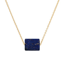 Load image into Gallery viewer, Gold chain necklace with a cylinder cut lapis lazuli stone
