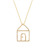 Gold chain necklace with house shaped pendant and small diamond