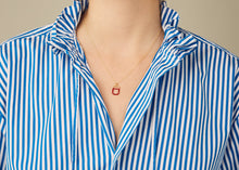 Load image into Gallery viewer, Gold chain necklace with raspberry ice pop pendant worn by model
