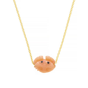 Gold chain necklace with mini pink crab shaped coral pendant