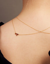 Load image into Gallery viewer, Gold rolo chain necklace with a baguett cut citrine and a baguette cut pink tourmaline on woman
