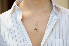 Load image into Gallery viewer, Gold chain necklace with heart shaped pendant and small baguette cut garnet worn by model
