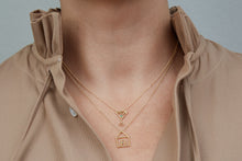 Load image into Gallery viewer, Gold necklaces with house and martini drick shaped pendants worn by model

