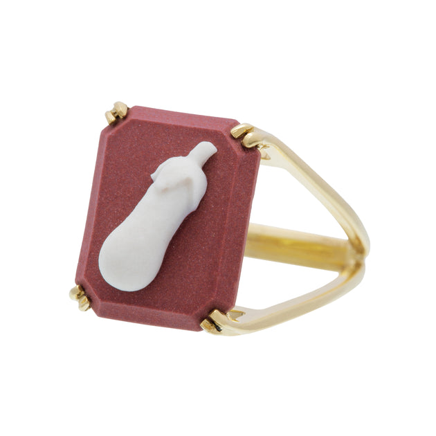 Gold ring with eggplant shaped cameo on porcelain
