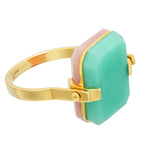 Gold turning ring with pink opal and crisopas octagonal shaped stones