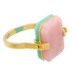 Gold turning ring with pink opal and crisopas octagonal shaped stones