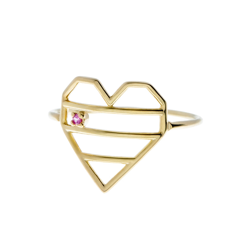 Gold striped heart shaped ring with a pink sapphire
