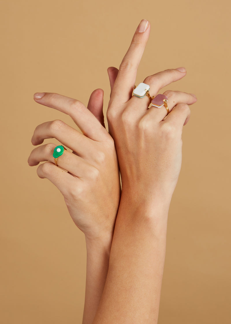 Gold rings with turquoise avocado and preciouse stones on model's hands