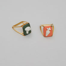 Load image into Gallery viewer, Gold rings with porcelain cameo shaped like broccoli and carrot
