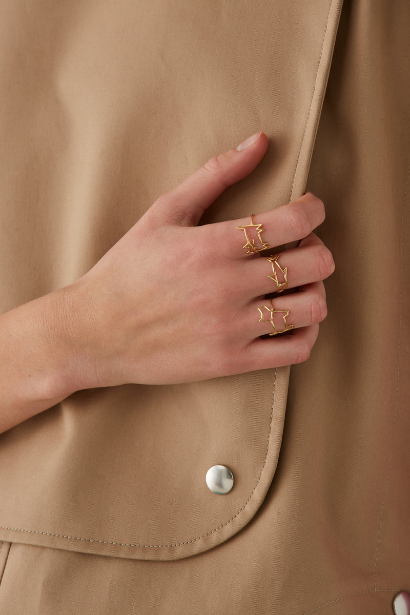 Gold perrito shaped ring worn by model
